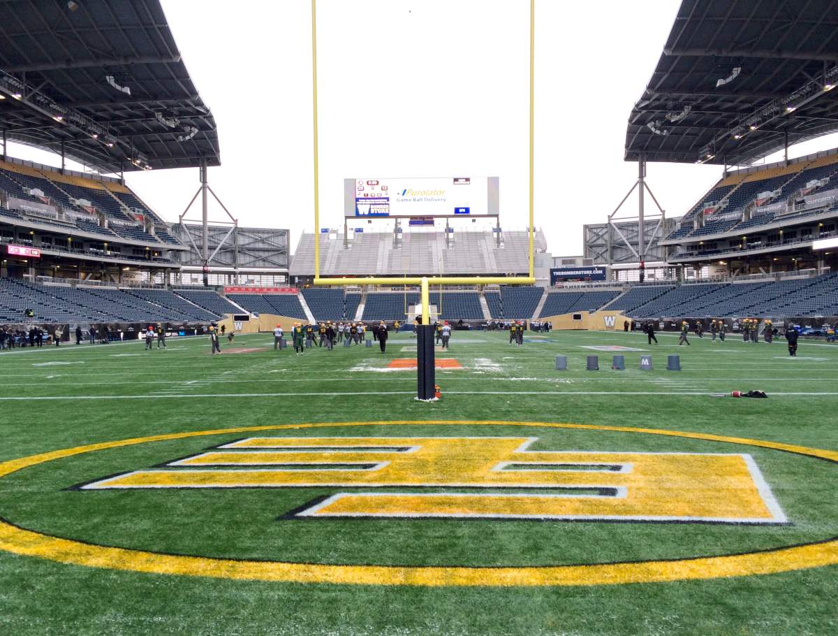 The Edmonton Eskimos take to the field for their first practice on the game day grounds.