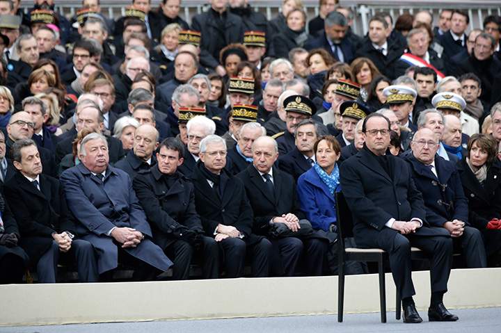 French President Francois Hollande attends a ceremony to honour the 130 victims killed in the Nov. 13 attacks, in the courtyard of the Invalides in Paris, Friday, Nov. 27, 2015.