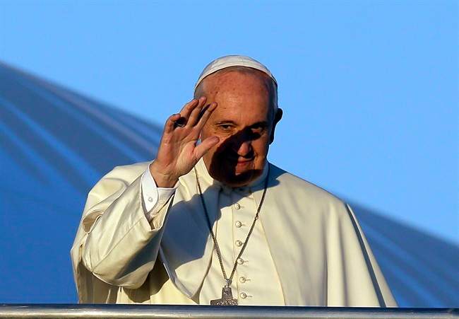 Pope Francis waves to journalists as he boards his airplane on the occasion of his trip to Africa, at Rome's Fiumicino International Airport, Wednesday, Nov. 25, 2015. Pope Francis is leaving for a trip that will take him to Kenya, Uganda and the Central African Republic, from Nov. 25-30.
