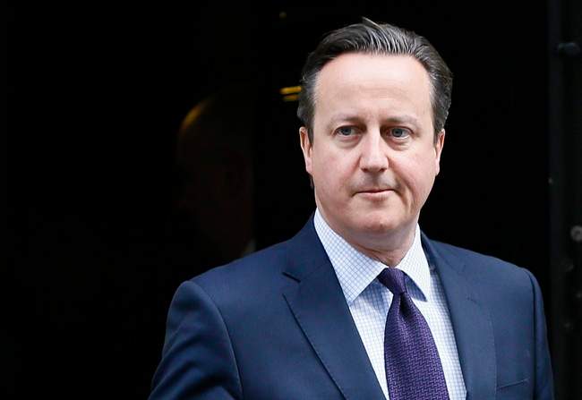 Britain's Prime Minister David Cameron leaves 10 Downing Street to attend Parliament in London, Thursday, Nov. 26, 2015.