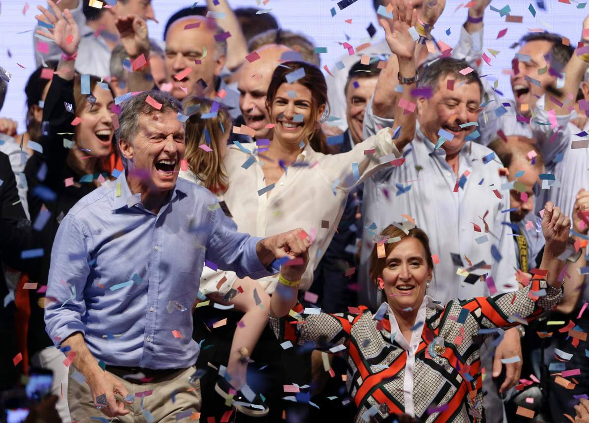 Opposition presidential candidate Mauricio Macri, left, and running mate Gabriela Michetti celebrate after winning a runoff presidential election in Buenos Aires, Argentina, Sunday, Nov. 22, 2015. 
