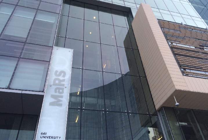 Exterior of the new glass tower MaRS building at the corner of College Street and University Avenue. 