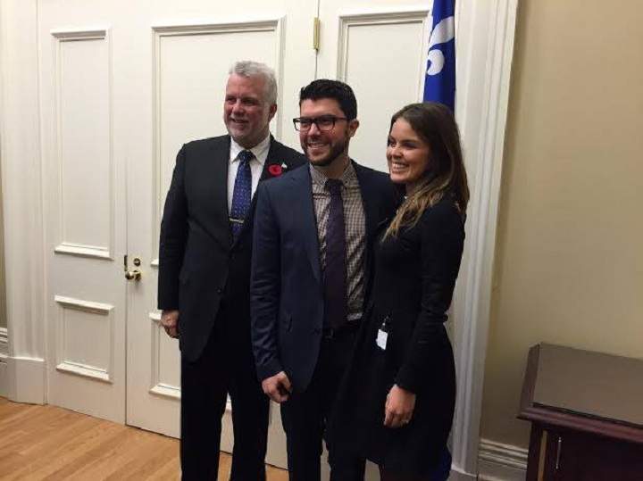 Matthew Schreindorfer and his wife, Katia Luciani pose for a picture with Quebec Premier Philippe Couillard.