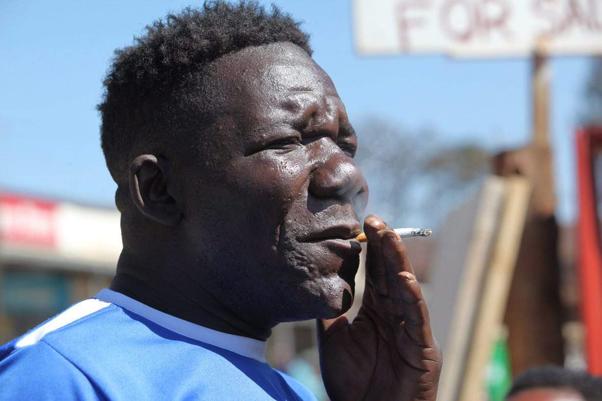 William Masvinu  is seen  working at a  Market in Mbare, Harare, in this June, 14, 2012 file photo. 