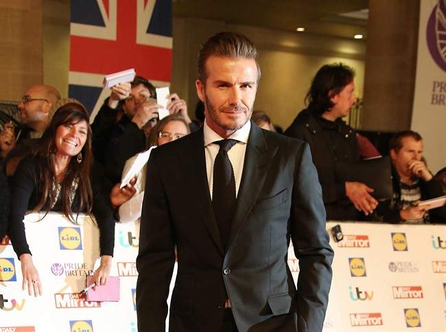 In this Monday, Sept. 28, 2015, file photo, David Beckham poses for photographers upon arrival at the Pride of Britain Awards 2015 in London.