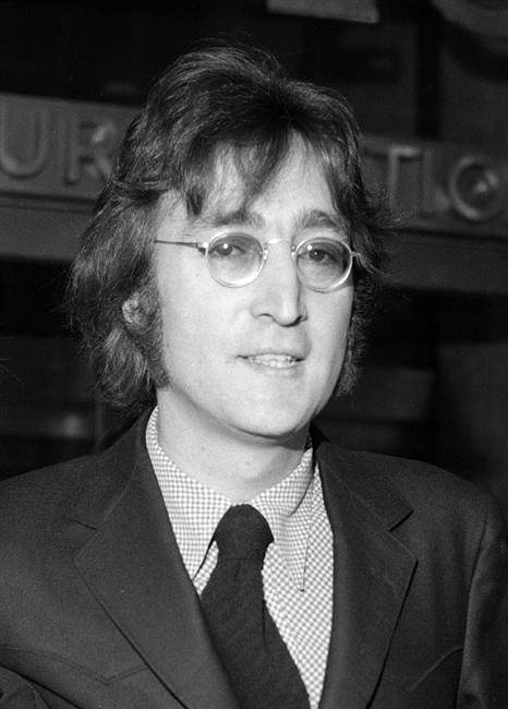 In this March 16, 1972, file photo, John Lennon leaves a deportation hearing at the offices of the Department of Immigration and Naturalization in New York.