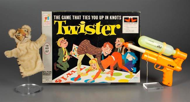 In this Sept. 24, 2015 photo provided by The Strong’s National Toy Hall of Fame in Rochester, N.Y., a puppet, the game of Twister and a Super Soaker are shown in a studio photo. On Thursday, Nov. 5, 2015, The Strong’s National Toy Hall of Fame announced that they have been chosen from a field of 12 finalists to be its 2015 inductees. 