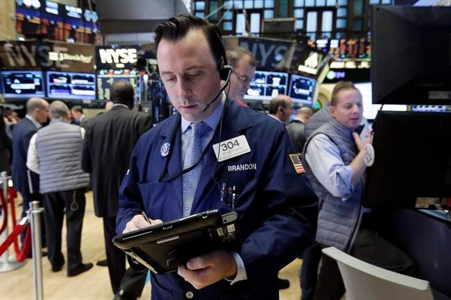 A trader works on the floor of the New York Stock Exchange, Monday, Nov. 2, 2015. 