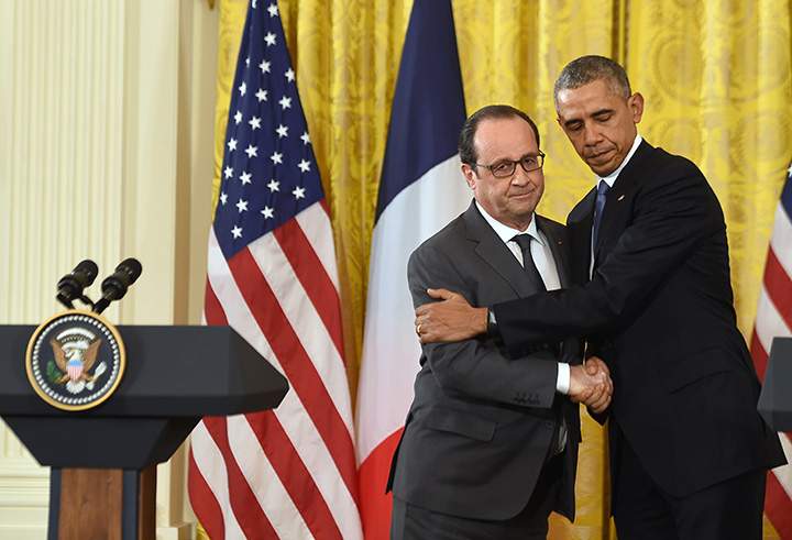 U.S. President Barack Obama and French President Francois Hollande shake hands during a joint press conference at the White House in Washington, DC, on November 24, 2015.