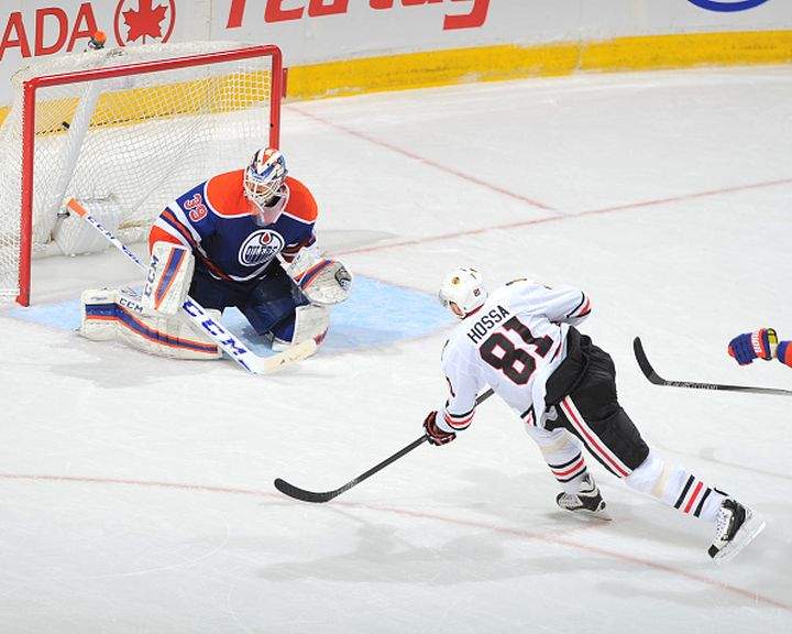 Marian Hossa #81 of the Chicago Blackhawks scores the game winning goal on Anders Nilsson #39 of the Edmonton Oilers on November 18, 2015 at Rexall Place in Edmonton, Alberta, Canada.