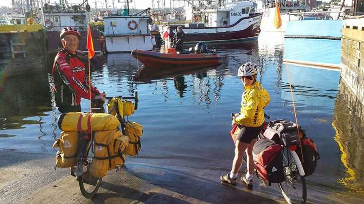 This photo shows Rob and Nancy Howse reaching the end of their second journey across Canada via bicycle.
