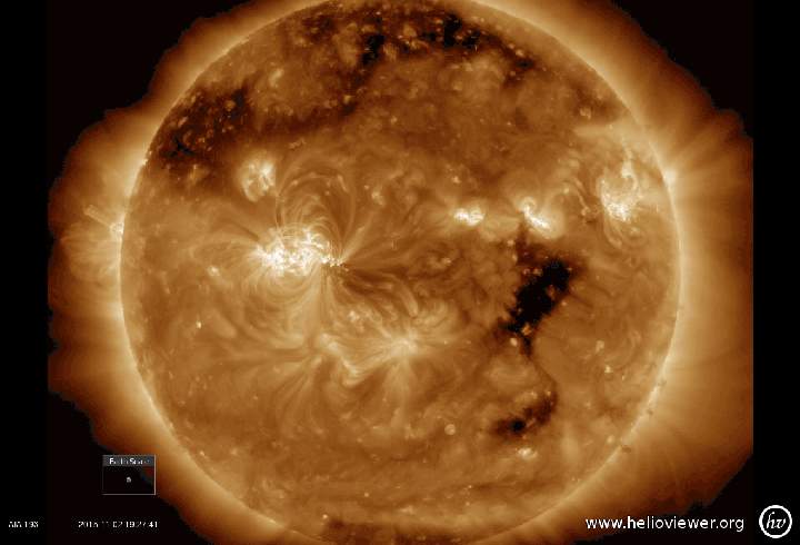 A coronal hole, the dark spot on the right, on the sun on Nov. 2.