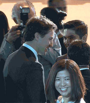 Justin Trudeau was mobbed for selfies by dozens of smiling delegates shortly after his arrival. /Global News