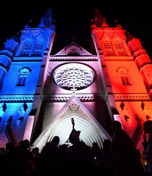 St Mary’s Cathedral as it is illuminated in the colours of the national flag of France, after he conducted a mass in honour of the victims and those affected by the recent Paris attacks, at St Mary’s Cathedral in Sydney, Australia, 16 November 2015.