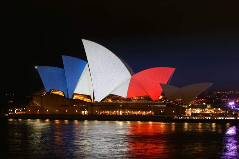 The Sydney Opera House lit up in the colours of the French Tricolore in Sydney, New South Wales.