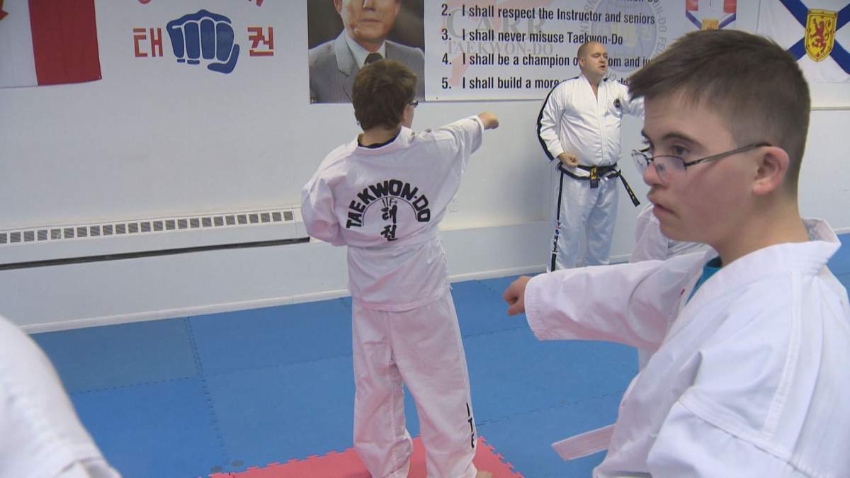 Ian Lan (right) practiced taekwondo moves on Tuesday.