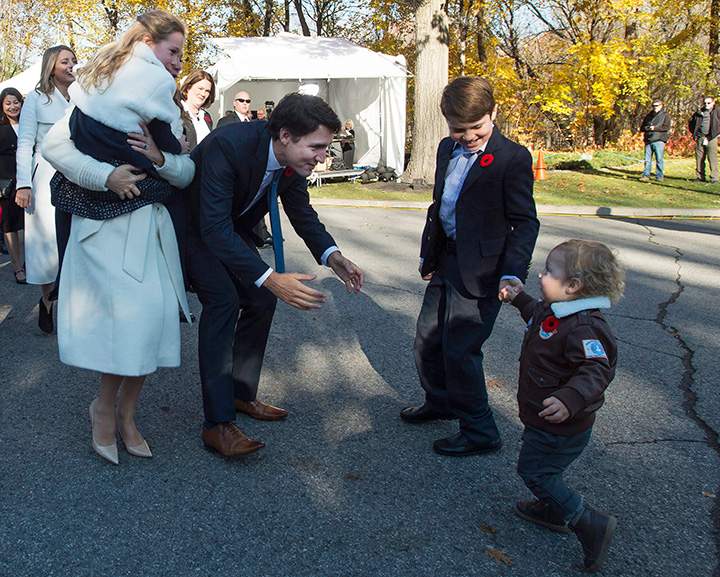 Hadrian Trudeau runs into his father’s arms as Prime Minister-designate Justin Trudeau, his wife Sophie Gregoire-Trudeau, Ella-Grace and their oldest son Xavier arrive at Rideau Hall in Ottawa on Tuesday, November 4, 2015.