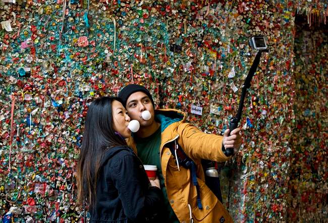 For some travellers, the selfie stick just isn't cutting it. They're willing to pay big bucks to get a pro to photograph them on vacation.