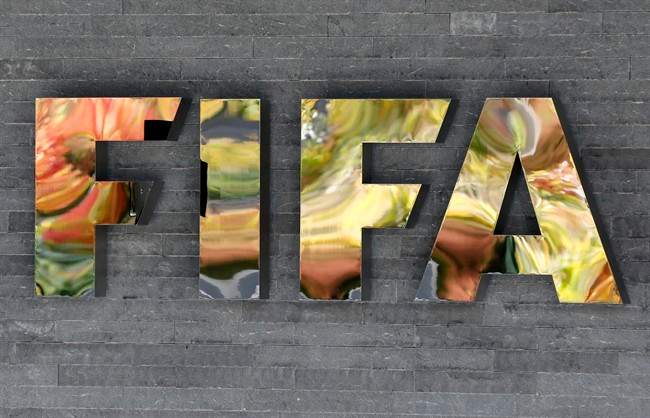 In this Sept. 25, 2015 file picture the FIFA logo is pictured on a wall of the FIFA headquarters in Zurich, Switzerland. 