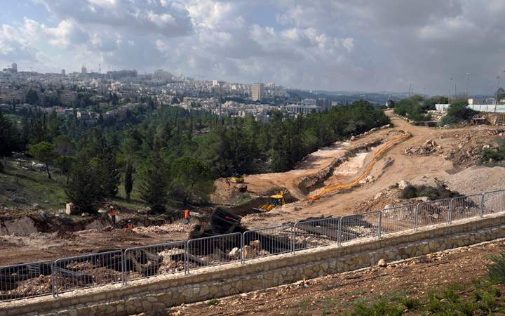 A view of infrastructure work underway in a neighborhood just north of Jerusalem, in an area that many consider the West Bank as it is built of pre-1967 Arab lands. Jerusalem is seen behind. 