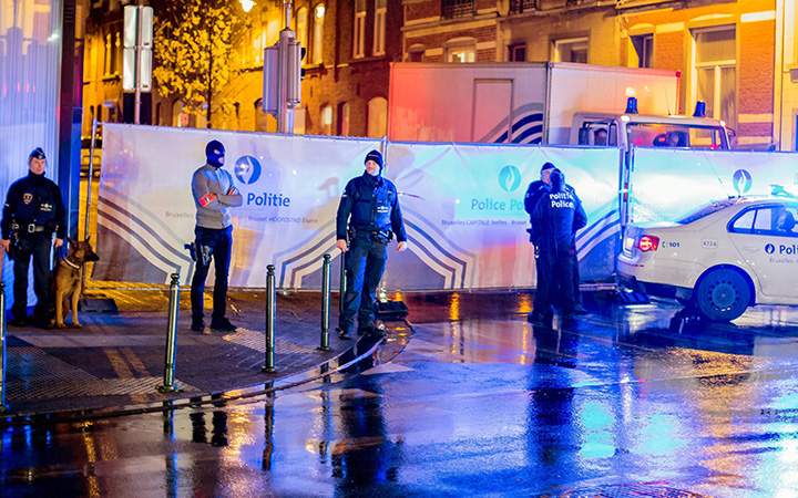 Police guard a street in Brussels where arrests were made linked to the attacks in Paris. 
