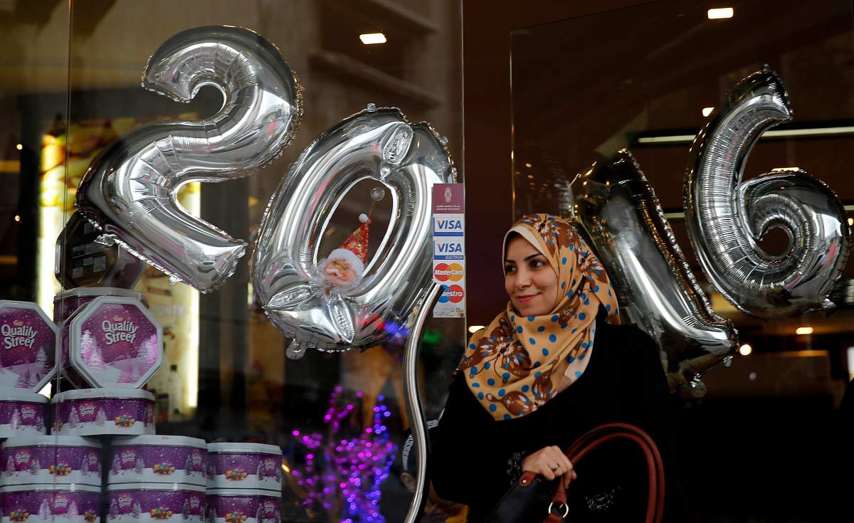 Palestinian women shop on the last day of 2015 in Gaza city, Thursday, Dec. 31, 2015.