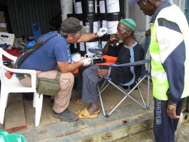 Andrew treating a patient in Liberia.