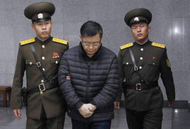 Hyeon Soo Lim, center, who pastors the Light Korean Presbyterian Church in Toronto, is escorted to his sentencing in Pyongyang, North Korea, Wednesday, Dec. 16, 2015.