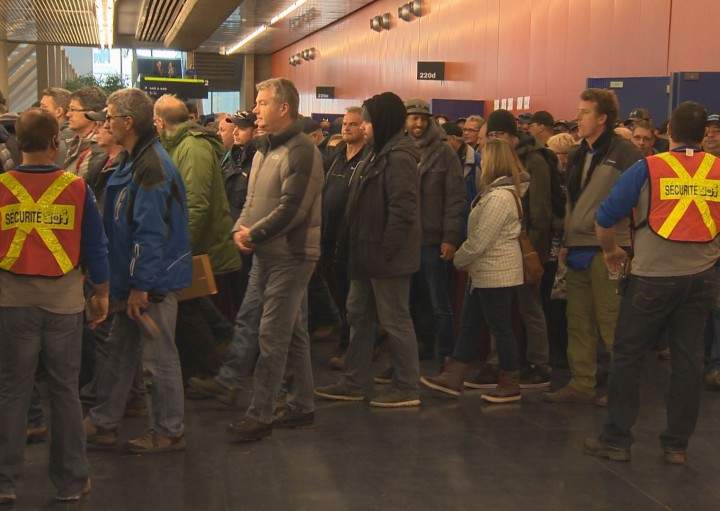 Blue collar workers attend a general assembly at the Palais de Congrès, Tuesday, December 8, 2015.