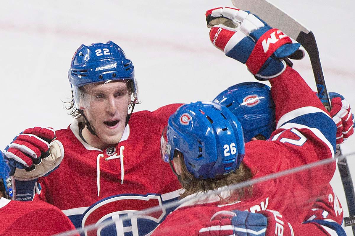 Montreal Canadiens' Jeff Petry (26) celebrates with teammate Dale Weise (22) after scoring against the Ottawa Senators during second period NHL hockey action, in Montreal, on Saturday, Dec. 12, 2015. 