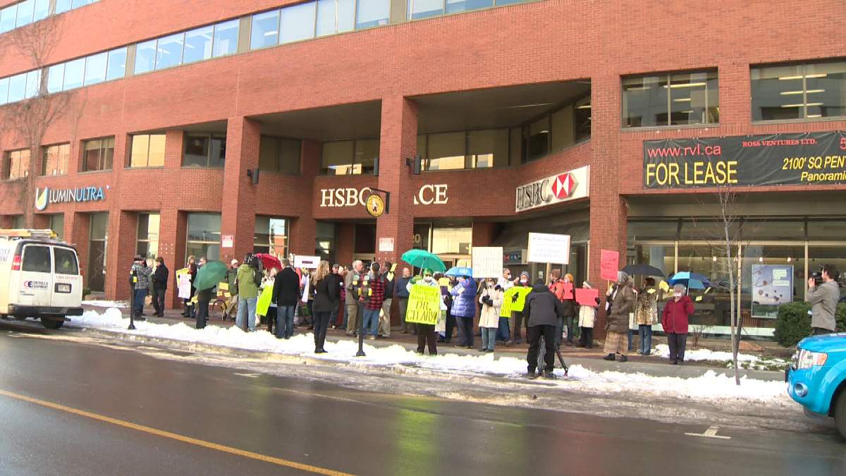 People protested Dr. Cleary’s leave outside HSBC Place in Fredericton.