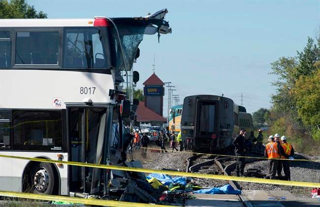 An OC Transpo bus sits where it collided with a Via Rail train during the morning commute, Wednesday September 18, 2013 in Ottawa. 