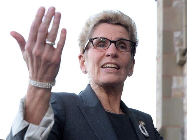 Ontario Premier Kathleen Wynne speaks to reporters as she arrives at the First Ministers meeting at the Canadian Museum of Nature in Ottawa on Monday, Nov. 23, 2015.