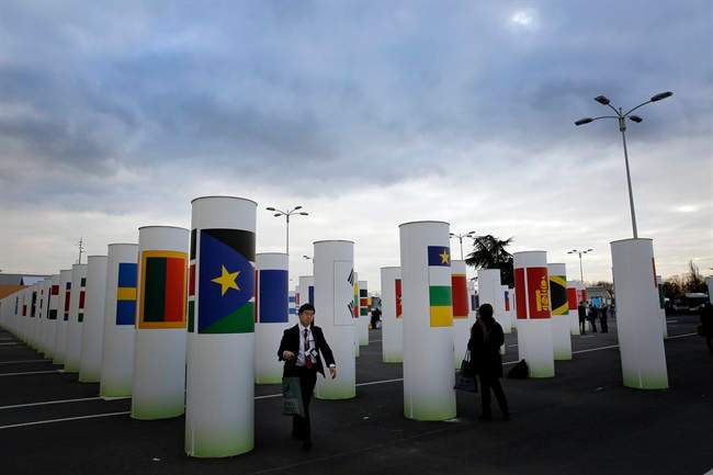 A man walks next to the entrance at the COP21, the United Nations Climate Change Conference Wednesday, Dec. 2, 2015 in Le Bourget, north of Paris.