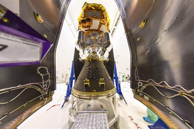 The Nov. 16, 2015 photo provided by European Space Agency ESA shows the LISA Pathfinder being encapsulated within the half-shells of the Vega rocket fairing on at the Centre Spatial Guyanais in Kourou, French Guiana.