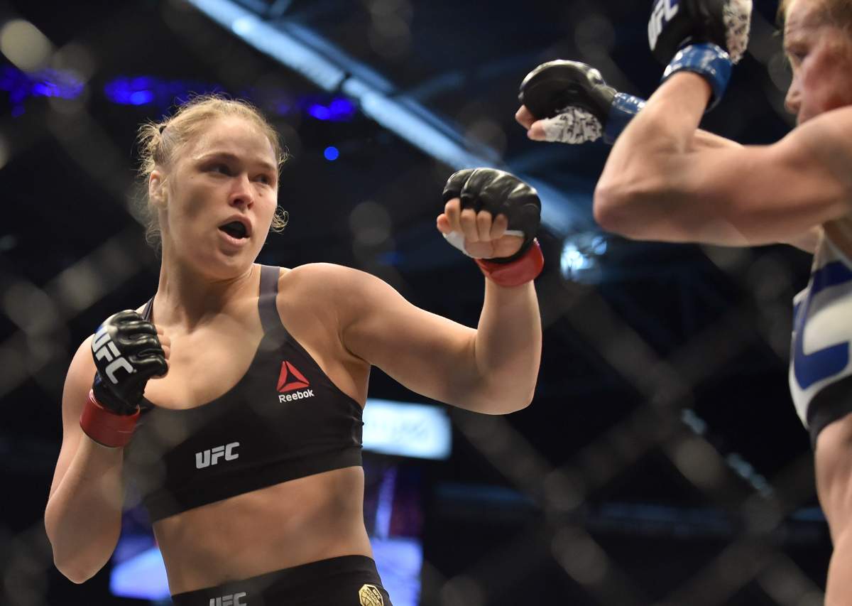 Ronda Rousey of the US (L) lines up compatriot Holly Holm during the UFC title fight in Melbourne on November 15, 2015.    