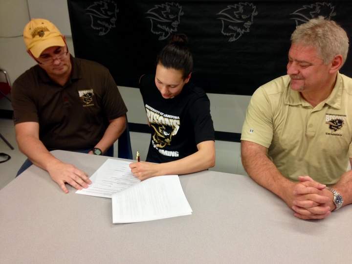 Winnipeg swimmer Kelsey Wog signs her letter of intent with the University of Manitoba Bisons.