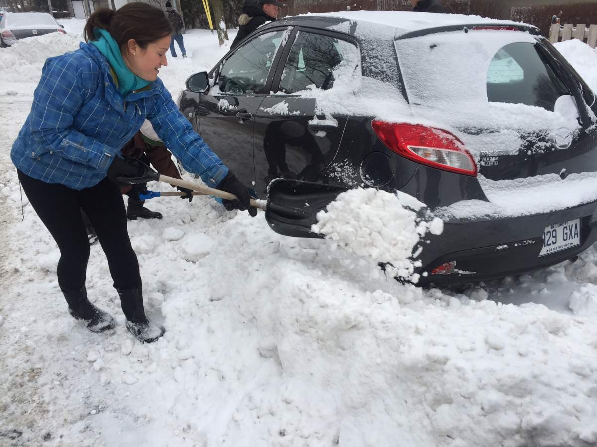 Paula Malolepszy shovels snow in Montreal on Wednesday, Dec. 30, 2015.