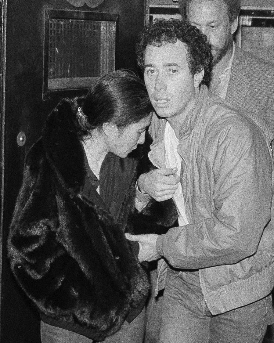 FILE – In this Dec. 9, 1980, file photo, Yoko Ono and record producer David Geffen leave Roosevelt Hospital in New York after the death of her husband, John Lennon. Thirty-five years ago, Mark David Chapman shot and killed Lennon, a former Beatles member. (AP Photo/Lyndon Fox, File)