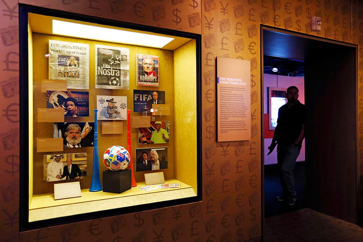 In this Tuesday, Sept. 1, 2015, file photo, Items on FIFA corruption are on display at the Mob Museum in Las Vegas. The display is titled "The 'Beautiful Game' Turns Ugly". All across Europe and the Americas as they plot legal strategy, await extradition hearings and consider the billable hours run up by their lawyers, FIFA officials can take comfort in this: They are serving the cause of art.