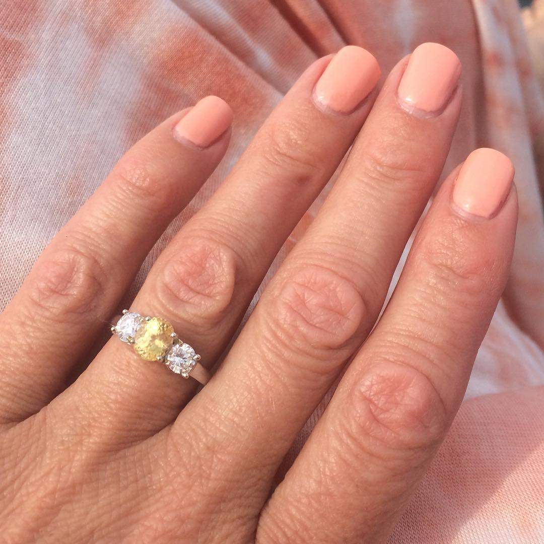 Nisa Drozdowski shows off her yellow Montana sapphire engagement ring.
