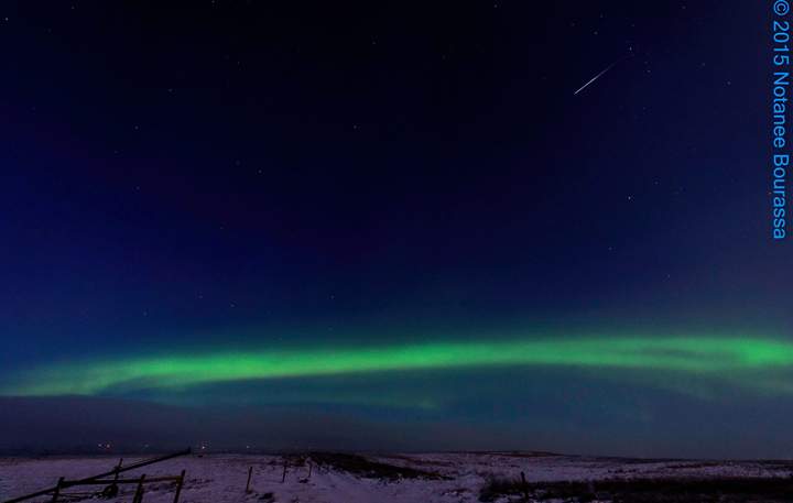 A meteor streaks above the northern lights 12km north of Regina, Saskatchewan.