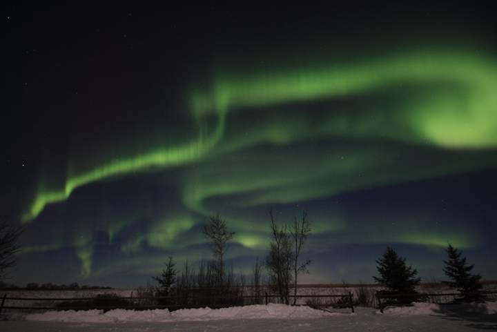 The northern lights dance across the sky on the night of Dec. 20-21 over the Gardiner Dam, about 100 km south of Saskatoon, Saskatchewan.