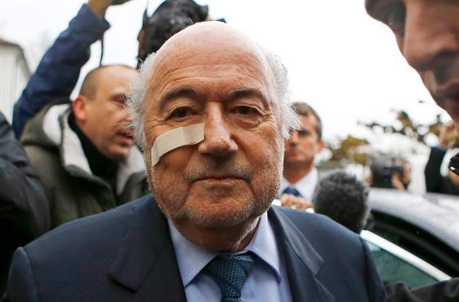 FILE - In this Dec. 21, 2015 file photo, FIFA President Sepp Blatter arrives for a news conference in Zurich, Switzerland, after he was banned for 8 years from all football-related activities over a $2 million payment by FIFA to Michel Platini, the president of European soccer's ruling body UEFA. 2015 was the year when scandals off the field of play eclipsed exploits on it. (AP Photo/Matthias Schrader, File).