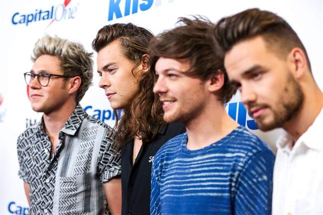 In this Friday, Dec. 4, 2015, file photo, Niall Horan, from left, Harry Styles, Louis Tomlinson and Liam Payne of One Direction arrive at 102.7 KIIS FM’s Jingle Ball iHeartRadio at Staples Center in Los Angeles, Calif.