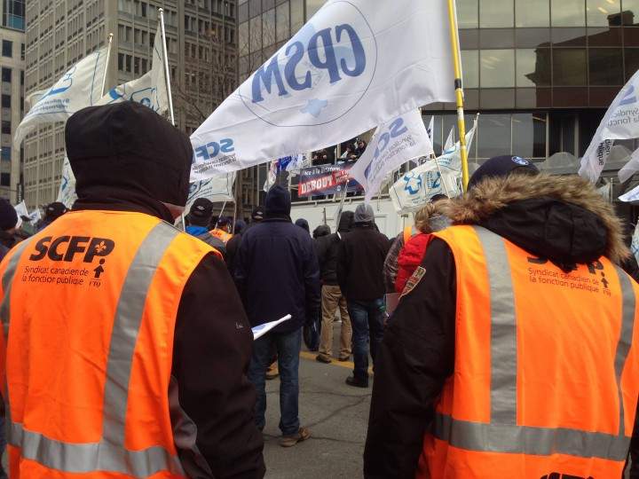 Blue collar workers protest in downtown Montreal, Monday, December 7, 2015.
