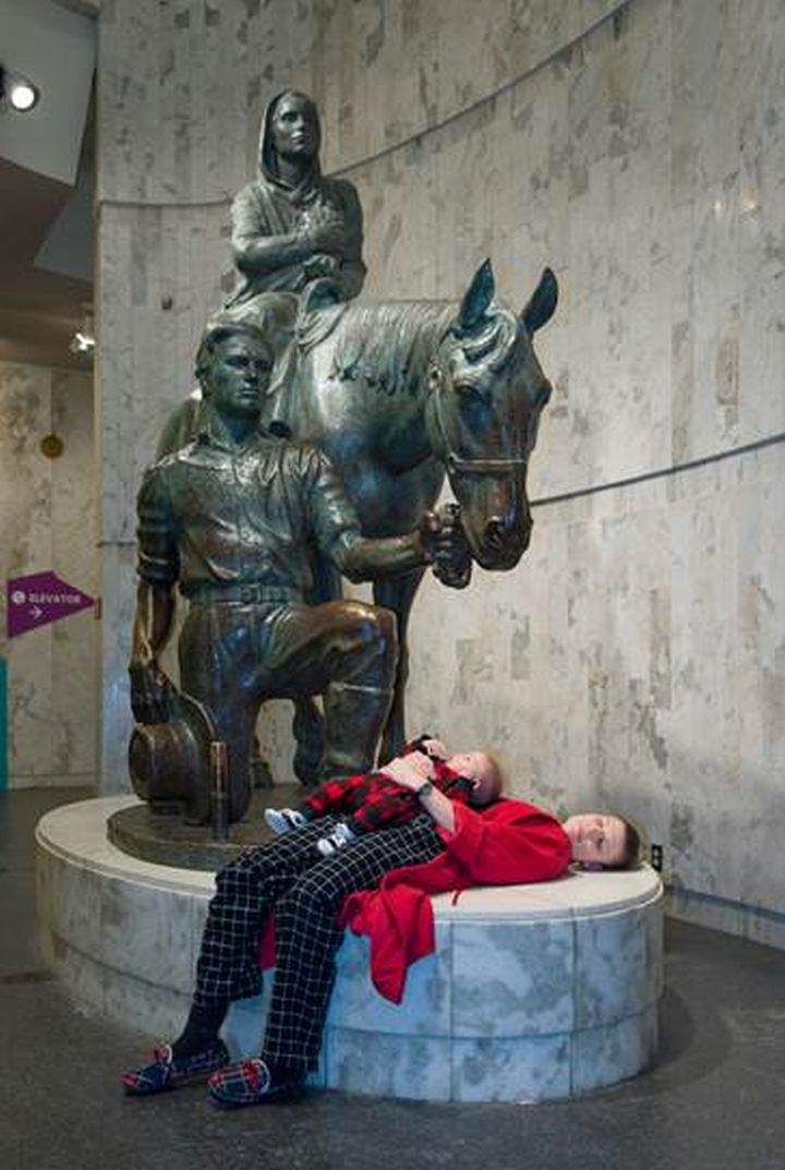Tory Ansuwan and six-month-old Phoenix Ansuwan take advantage of a rare opportunity to put on their pajamas and spend a night at the Royal Alberta Museum.