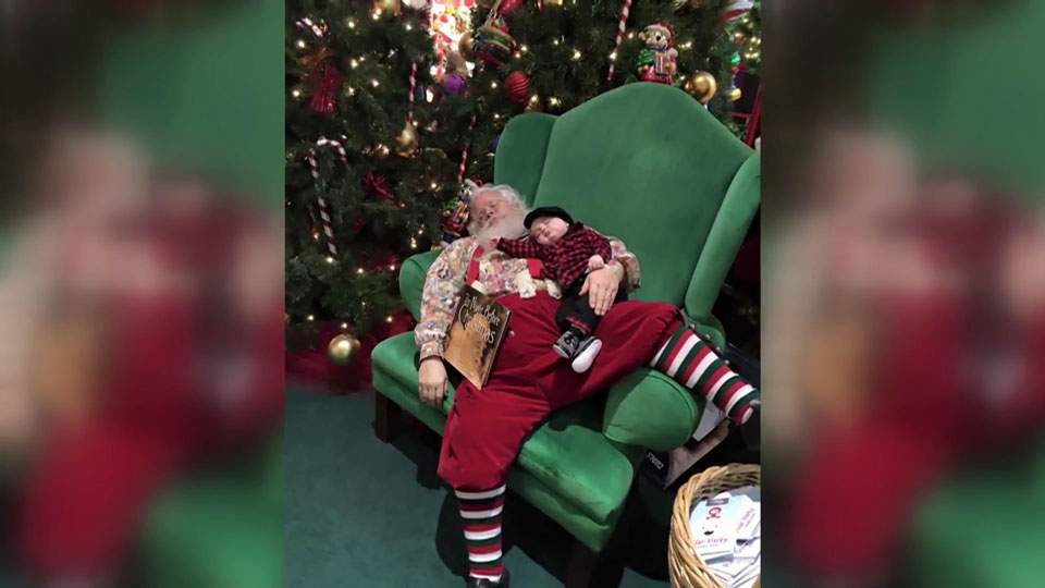 Shh! Baby and Santa take a nap during photo, picture goes viral - image