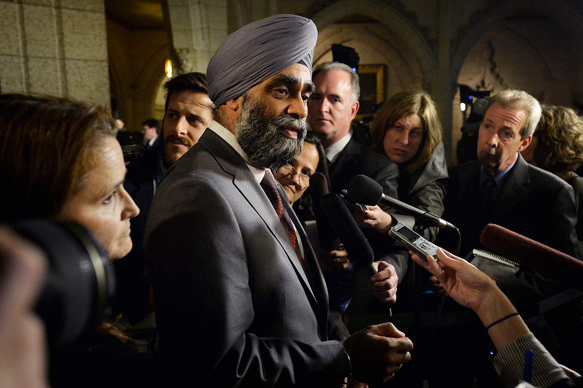 Defence Minister Harjit Sajjan scrums with media in Ottawa on Monday.