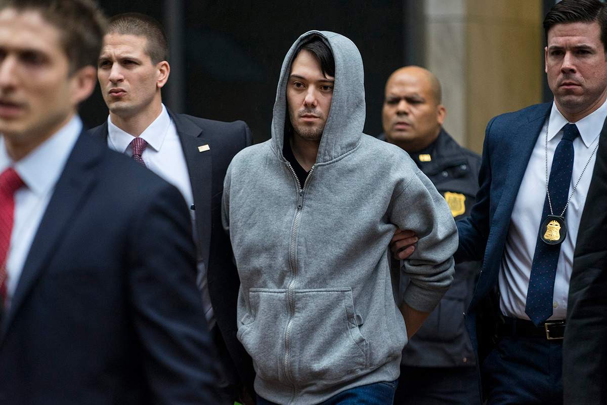  In this Dec. 17, 2015 file photo, Martin Shkreli, the former hedge fund manager under fire for buying a pharmaceutical company and ratcheting up the price of a life-saving drug, is escorted by law enforcement agents in New York.